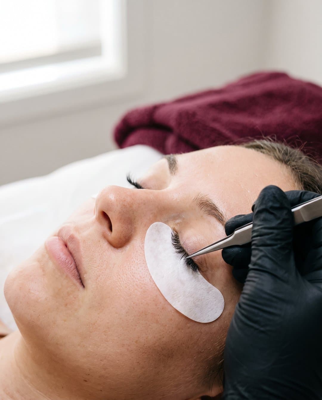 Illustrative image of a lash extension being placed