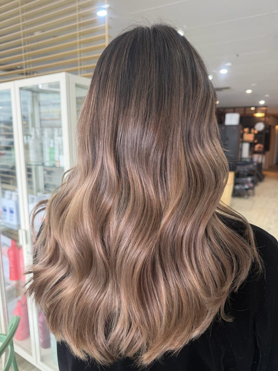 Soft brunette balayage with a cool, glossy finish